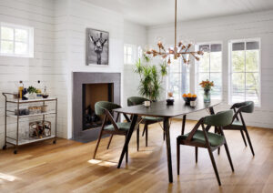 a room with dining table and Pellman Chandelier