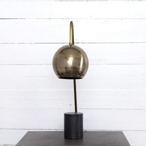 Globe shaped shade finished in antique brass